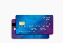 Two credit cards with a blue geometric design, one overlaying the other, highlight the looming credit card crisis. The front card shows a chip, card number, and placeholders for cardholder name, valid date, and expiry date—reminders of potential credit card debt pitfalls.