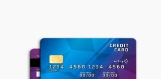 Two credit cards with a blue geometric design, one overlaying the other, highlight the looming credit card crisis. The front card shows a chip, card number, and placeholders for cardholder name, valid date, and expiry date—reminders of potential credit card debt pitfalls.