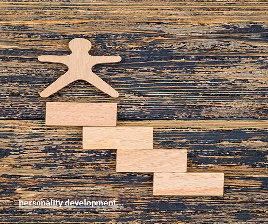 A wooden figure stands on ascending blocks, symbolizing the challenges of personality development. Text reads "personality development.