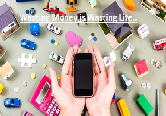 Hands holding a smartphone surrounded by toy houses, cars, tools, coins, and a calculator, with the text "Wasting Money is Wasting Life" above.