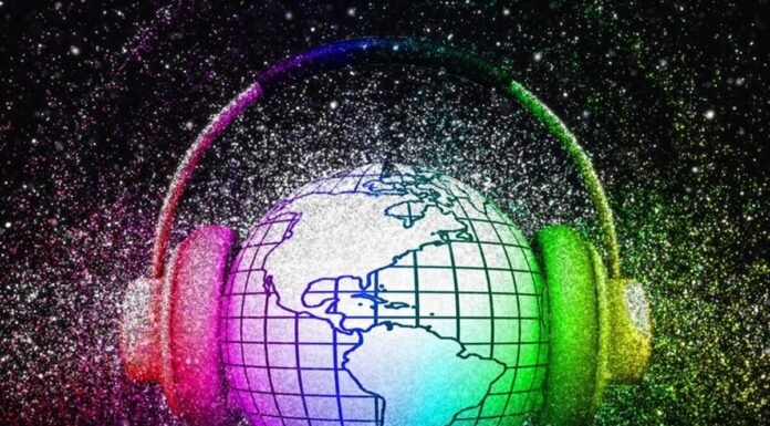 A globe with grid lines is encircled by headphones. The image is surrounded by a colorful, glittery background. The world is listening.