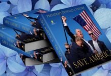 Stack of books titled "Save America" with a cover image featuring a man holding an American flag against a background of blue hydrangeas.