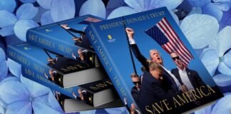 Stack of books titled "Save America" with a cover image featuring a man holding an American flag against a background of blue hydrangeas.