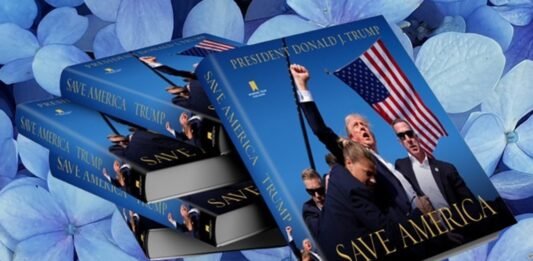 Stack of books titled "Save America" with a cover image featuring a man holding an American flag against a background of blue hydrangeas.