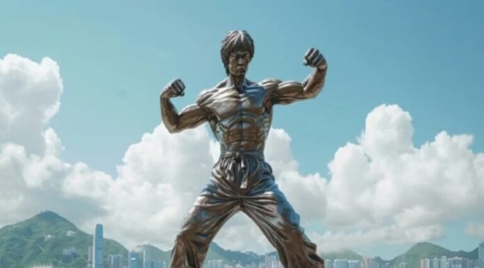 A bronze statue of a martial artist strikes a dynamic fighting pose, set against a waterfront cityscape where other statues stand sentinel under cloudy skies and distant mountains.